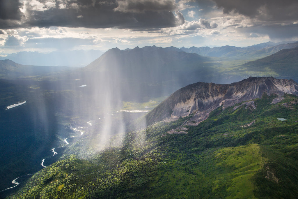 Rainfall over the lush green valleys of the Wrangell Mountains in Alaska