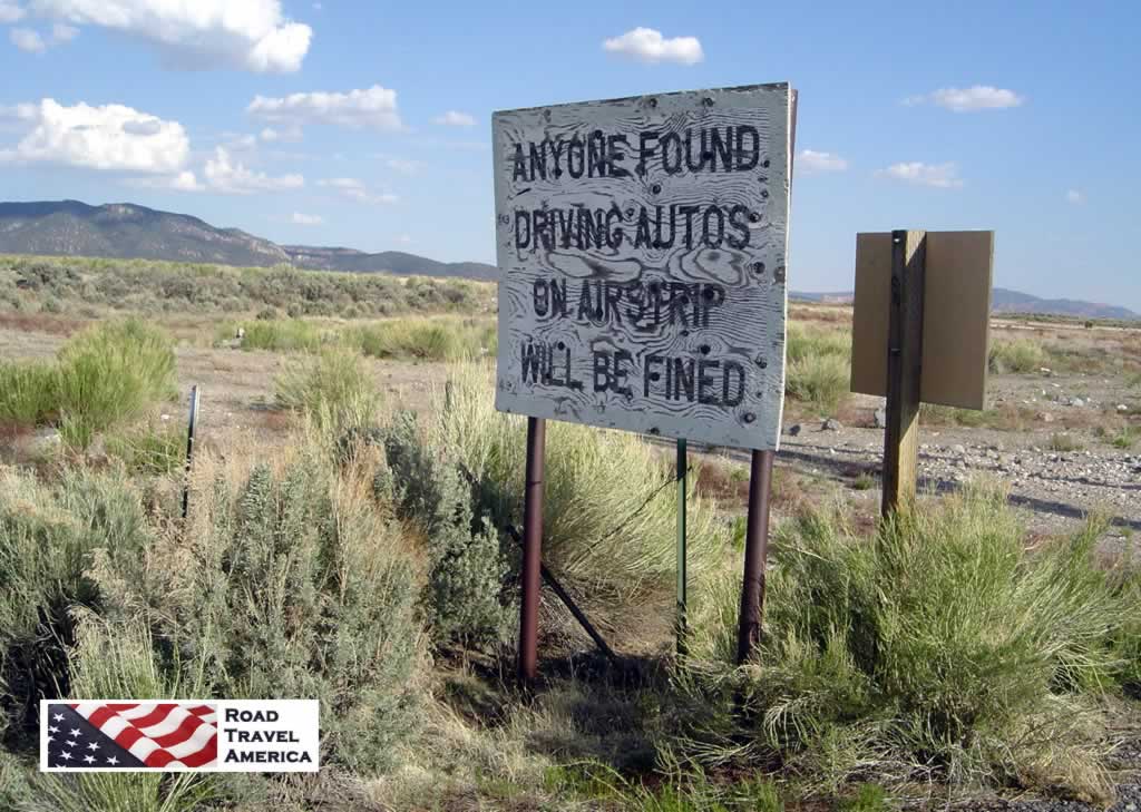 Sign at the Panguitch, Utah Airport ... "Anyone found driving autos on airstrip will be fined"