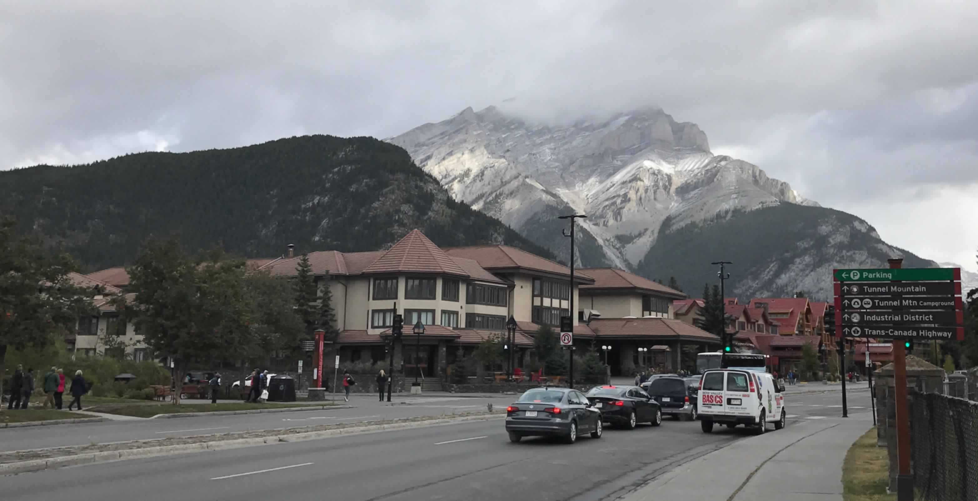 Banff Avenue, looking north, with the red roofs of the Moose Hotel on the left in the distance