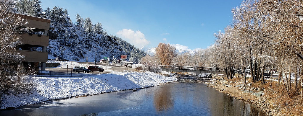 View in winter of the river next to the Estes Park Parking Structure